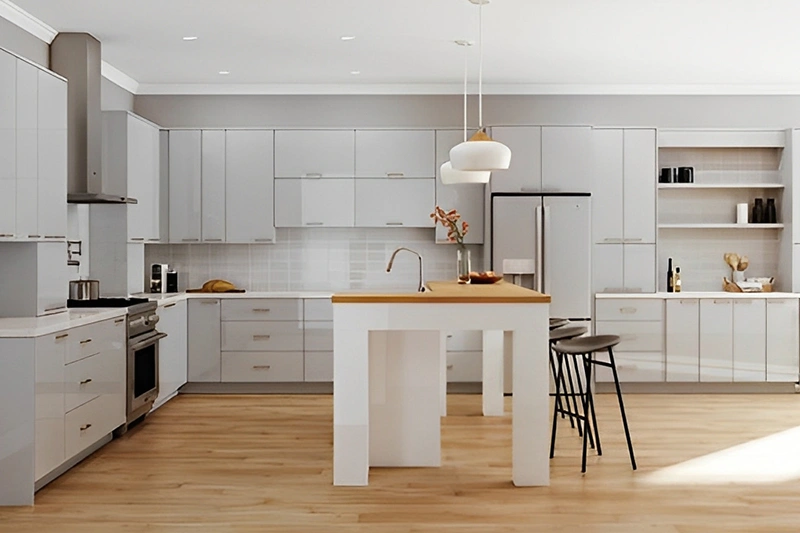 Modern kitchen with white cabinets and wooden island.