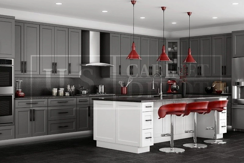 Modern kitchen with red accents and sleek gray cabinets.
