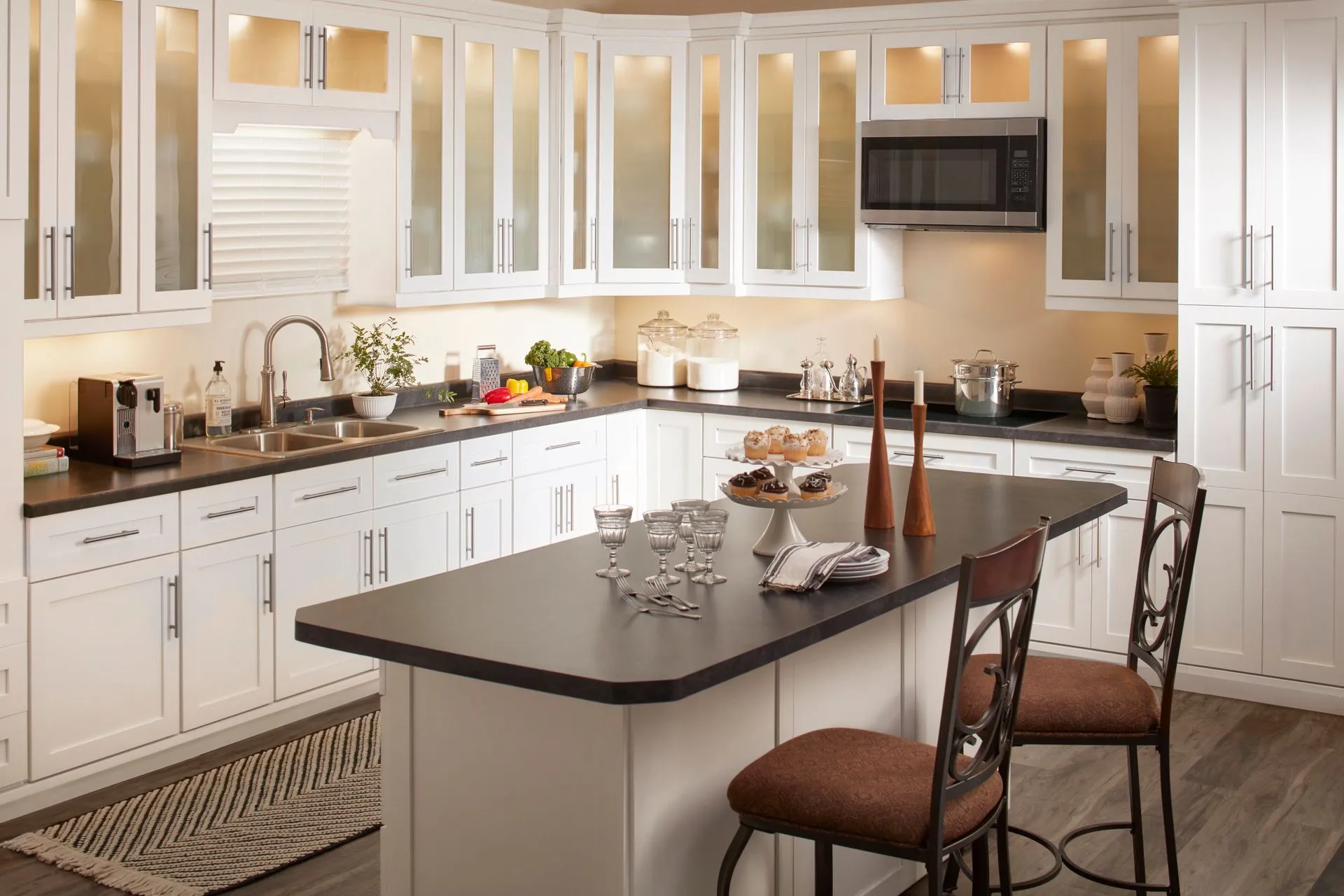 Modern kitchen with white cabinets and an island.