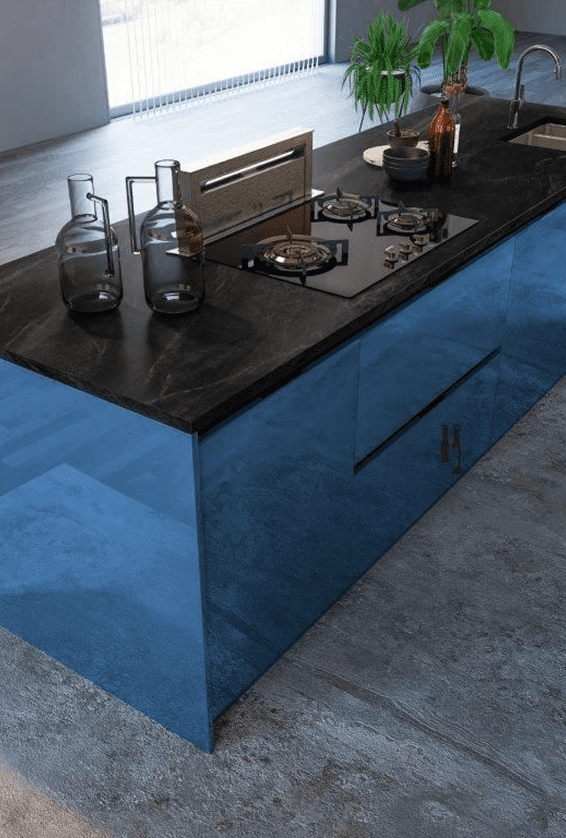 Modern kitchen island with a blue base and black countertop.